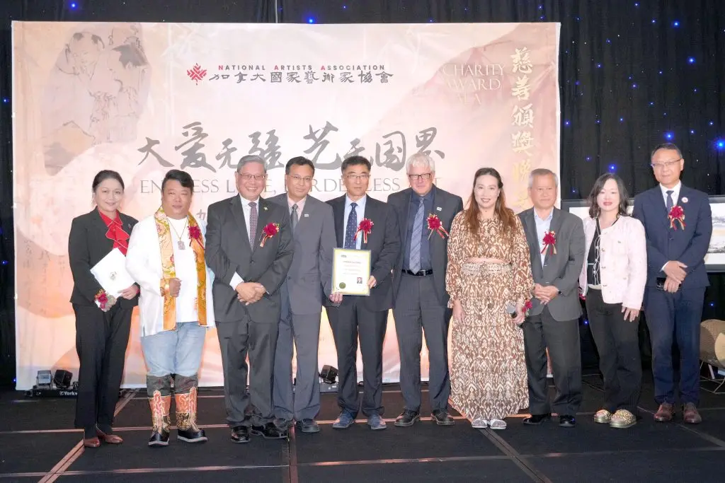 Award recipients and dignitaries on stage at the 2024 International Exhibition charity gala